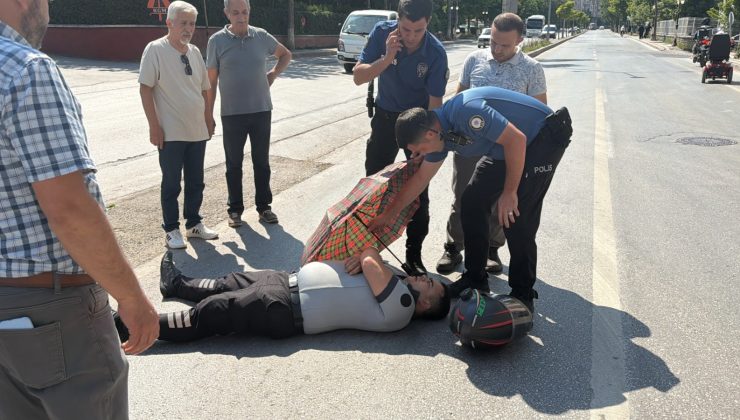 POLİS EKİPLERİ YARALIYI ŞEMSİYE İLE GÜNEŞTEN KORUDU